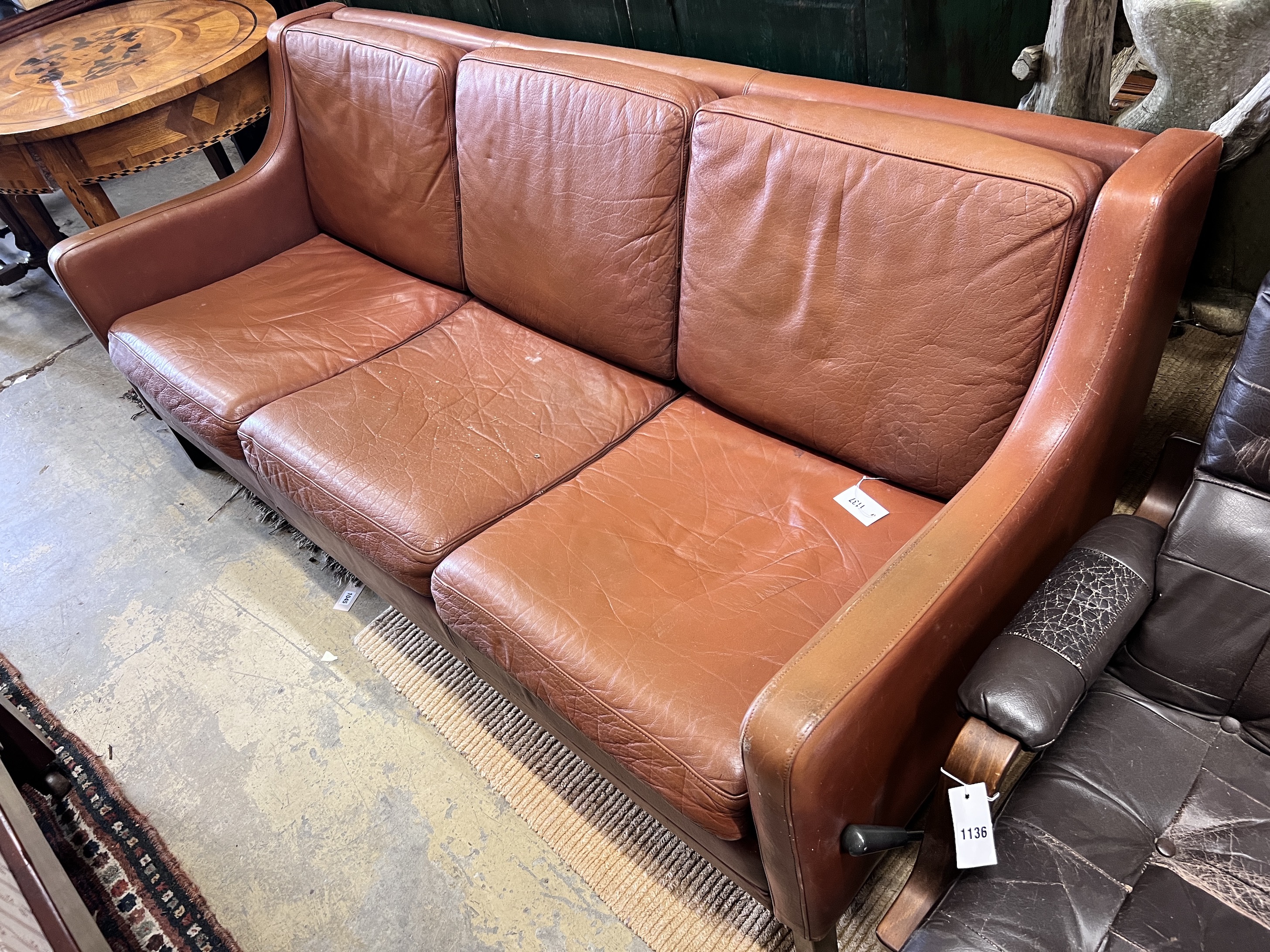 A mid century Danish tan leather sofa in the style of Borge Mogensen, length 182cm